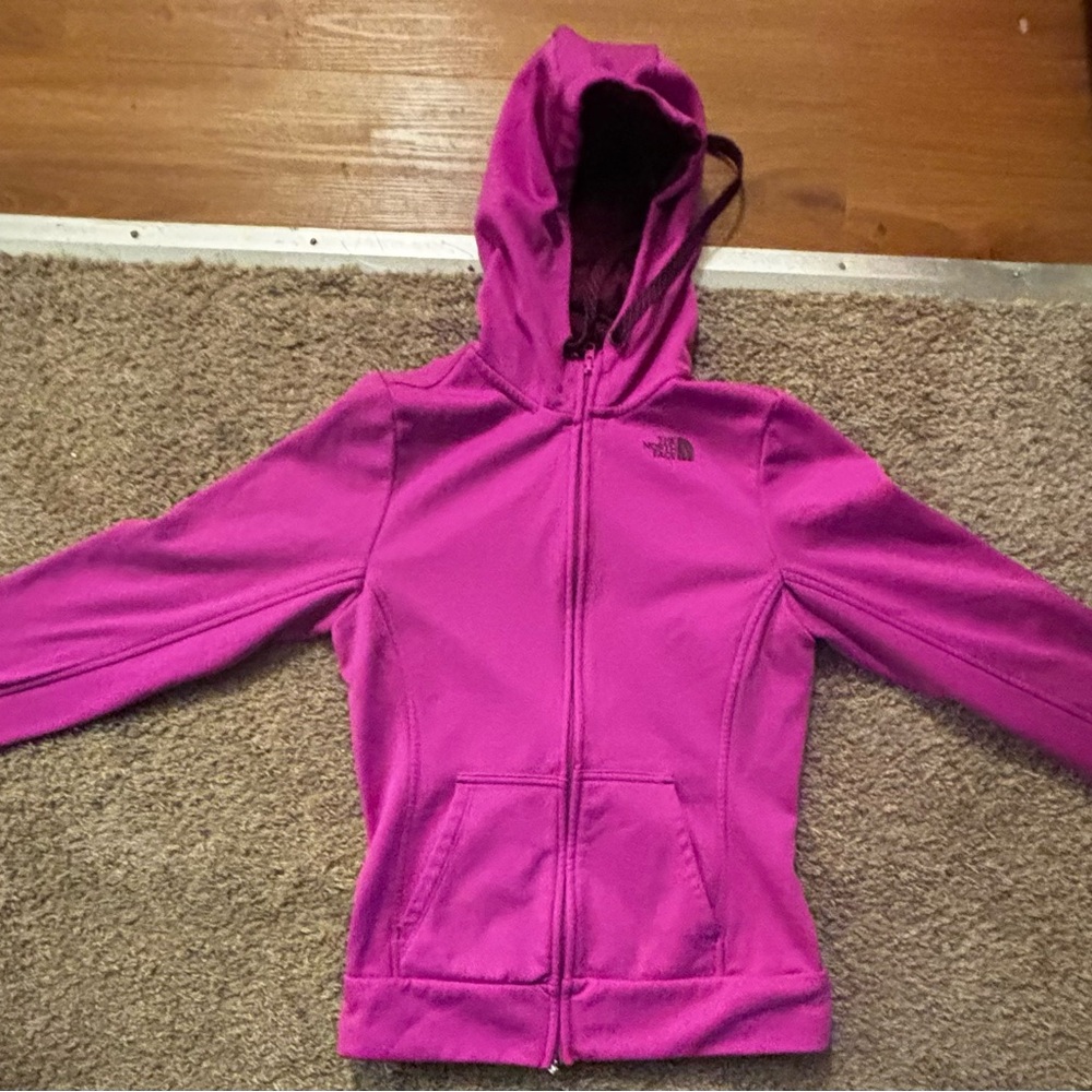 The North Face woman’s size small fuchsia colored Zip up Like new condition